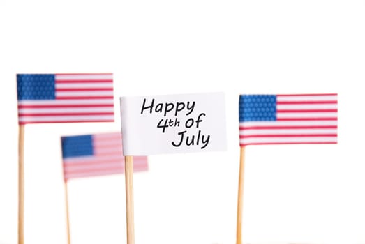 A White Flag with Happy 4th of July and some American Flags in the Background, Isolated
