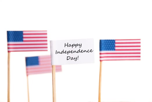 Happy Independence Day on a White Banner with American Flags in the Background, Isolated
