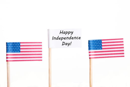 White Banner with Happy Independence Day and two American Flags besides, Isolated