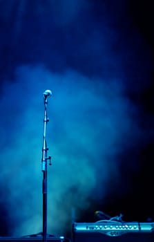 Microphone in stage lights on the stage