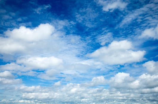 blue sky background with tiny clouds