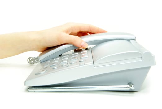 telephone receiver in hand isolated on white