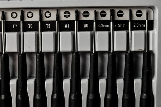 A set of screwdriver on a black background