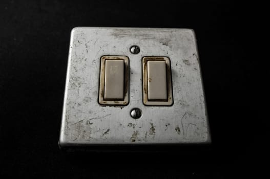Light switch, old-style on a Black Background