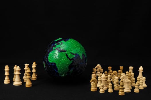 Globe And White Chess on a Black Background