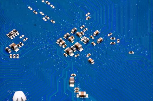 Macro Photo Of Electronic Circuit. Pcb On The Lighting.