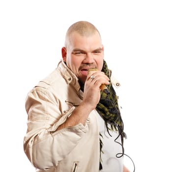 middle age  man sings into a microphone on a white background