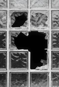 destroyed window of an abandoned factory