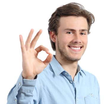 Young happy positive teenager man gesturing ok isolated on a white background