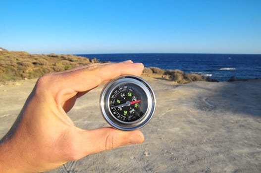 Orientation Concept a Male Hand Holding a Metal Compass