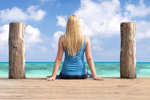 Woman looks out to sea