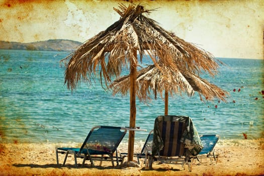 Vintage photo of chairs and umbrellas on the beach