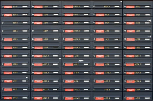 The photograph of lockers or stacked and rowed letterboxes.