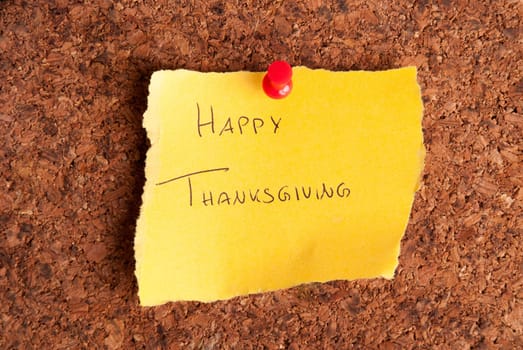 A Yellow Notepad with Happy Thanksgiving on it