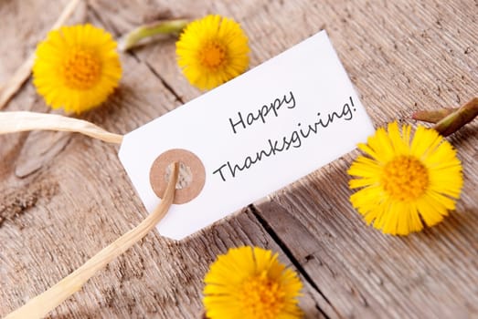 White Tag with Happy Thanksgiving and Yellow Flowers