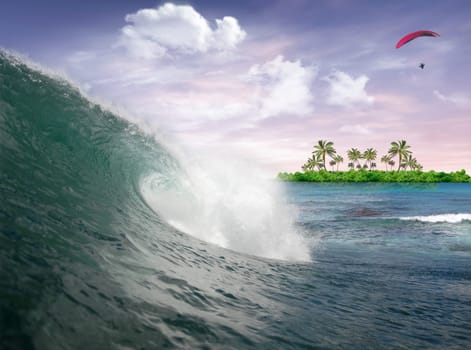 Wave in the Ocean at the sunrise with man flying in the sky and tropical island in the background