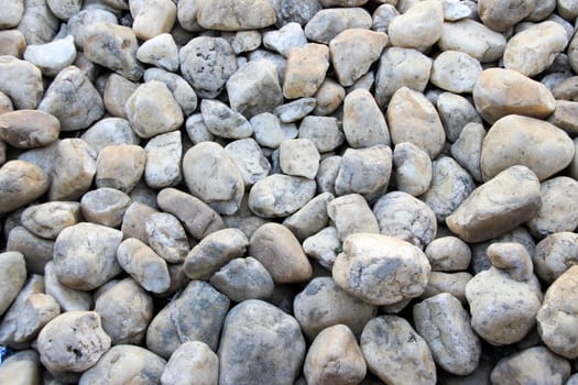 Pavement laid with round edged, grey and pink pebbles