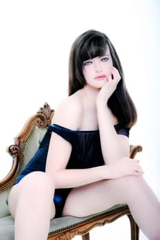 beautiful woman in swimwear sitting on chair