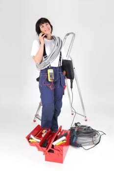 woman electrician with tools