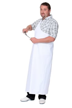 Man sharpening knife