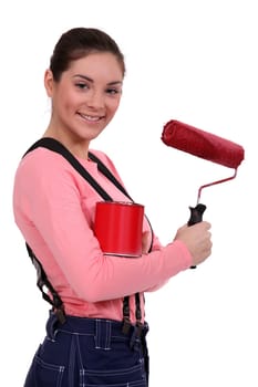 Woman with a tin of red paint and a roller