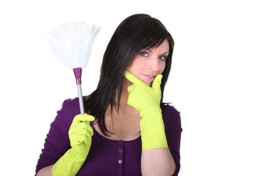 A maid with a feather duster
