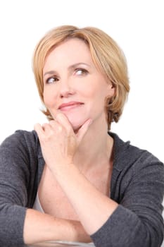 Portrait of blond woman with hand to face