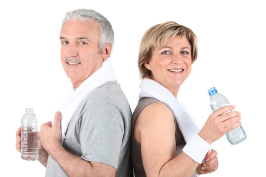 Mature couple drinking water