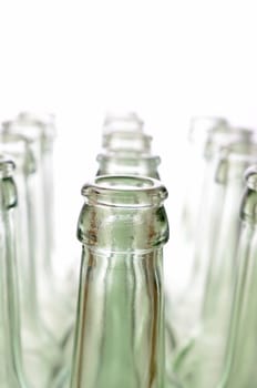 Empty bottles on a white background, selective focus on foreground