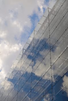 Cloudy reflections on a business building