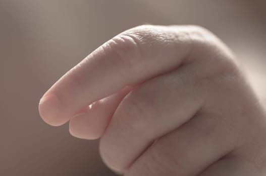 Close up of baby girls' sweet little hand and fingers