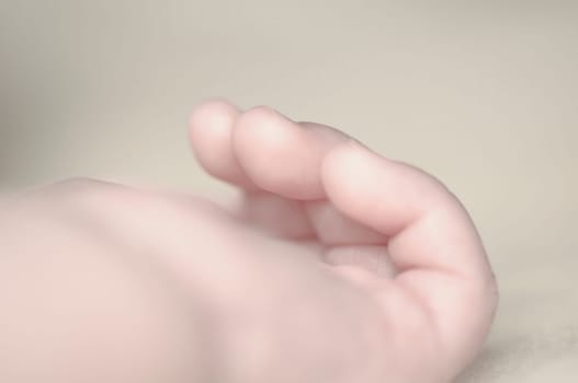 Close up of baby girls' sweet little hand and fingers