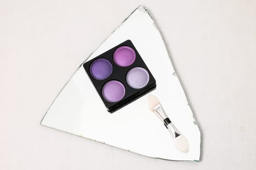 Make-up Palette Of Colorfully Eyeshadows Over White Background