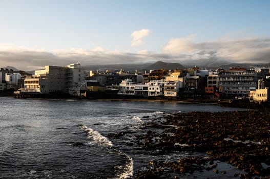 Sea and Building at Sunset in El Medano Tenerife Canary Islands