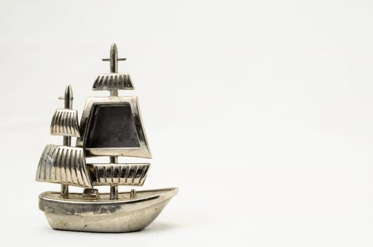 Metal Sailing Boat Figurine on a white background