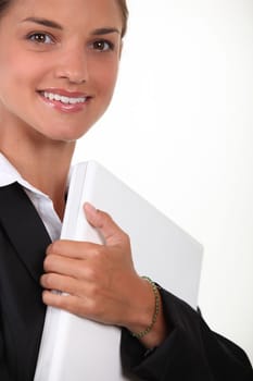 Businesswoman holding laptop