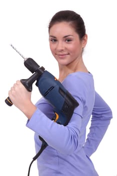 A woman holding a drill.