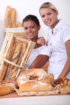 Two young women working in a bakery