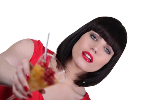 Young woman with fruits cocktail