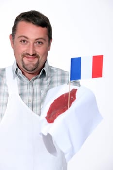 Butcher holding French beef