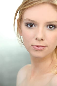 Close-up of ginger girl with bare shoulder