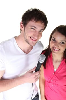 Couple sharing a microphone