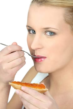 Woman eating bread and jam