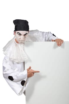 Man dressed as clown with message board
