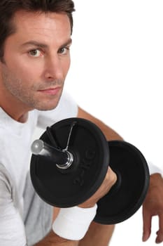 portrait of a man with dumbbell
