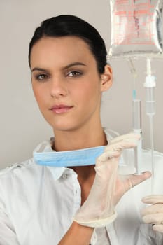 Doctor preparing an intravenous injection