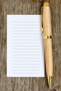 Wooden pen and note paper for your own text