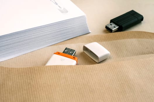 Stack of white envelopes and USB flash memory drives as concept