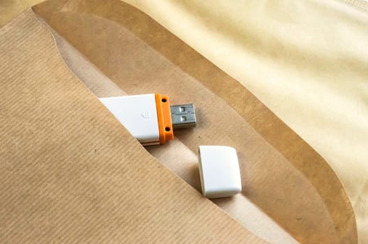 Brown envelope and USB flash memory drive as concept