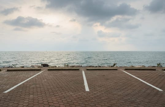 Empty parking lot with seascape
